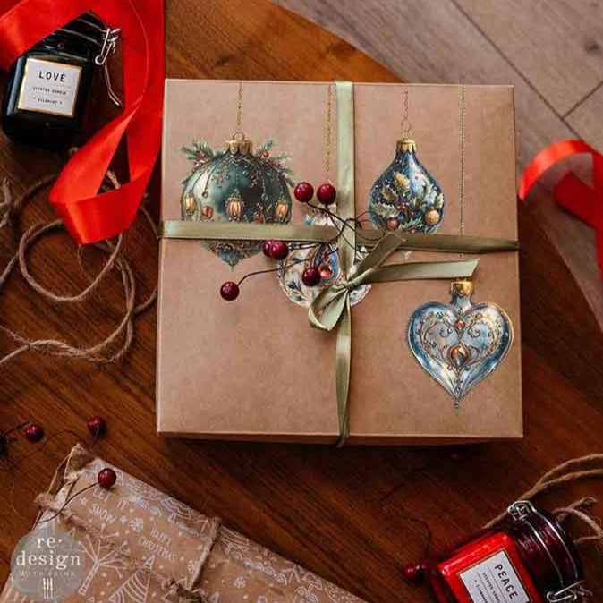 Gift box with decorative ribbons and ornaments on a wooden surface