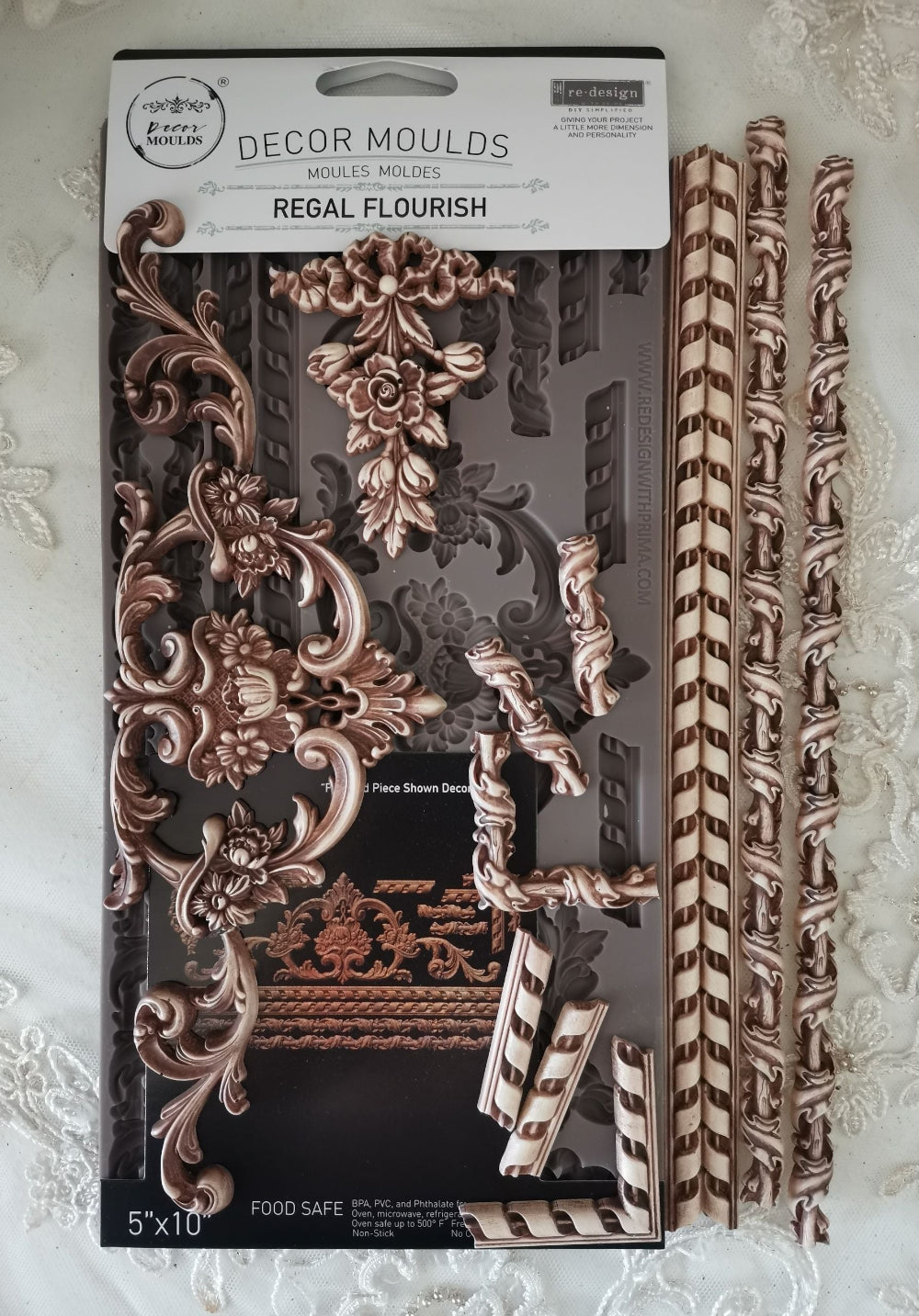 Decorative moulds packaging with decorative elements on a textured white background