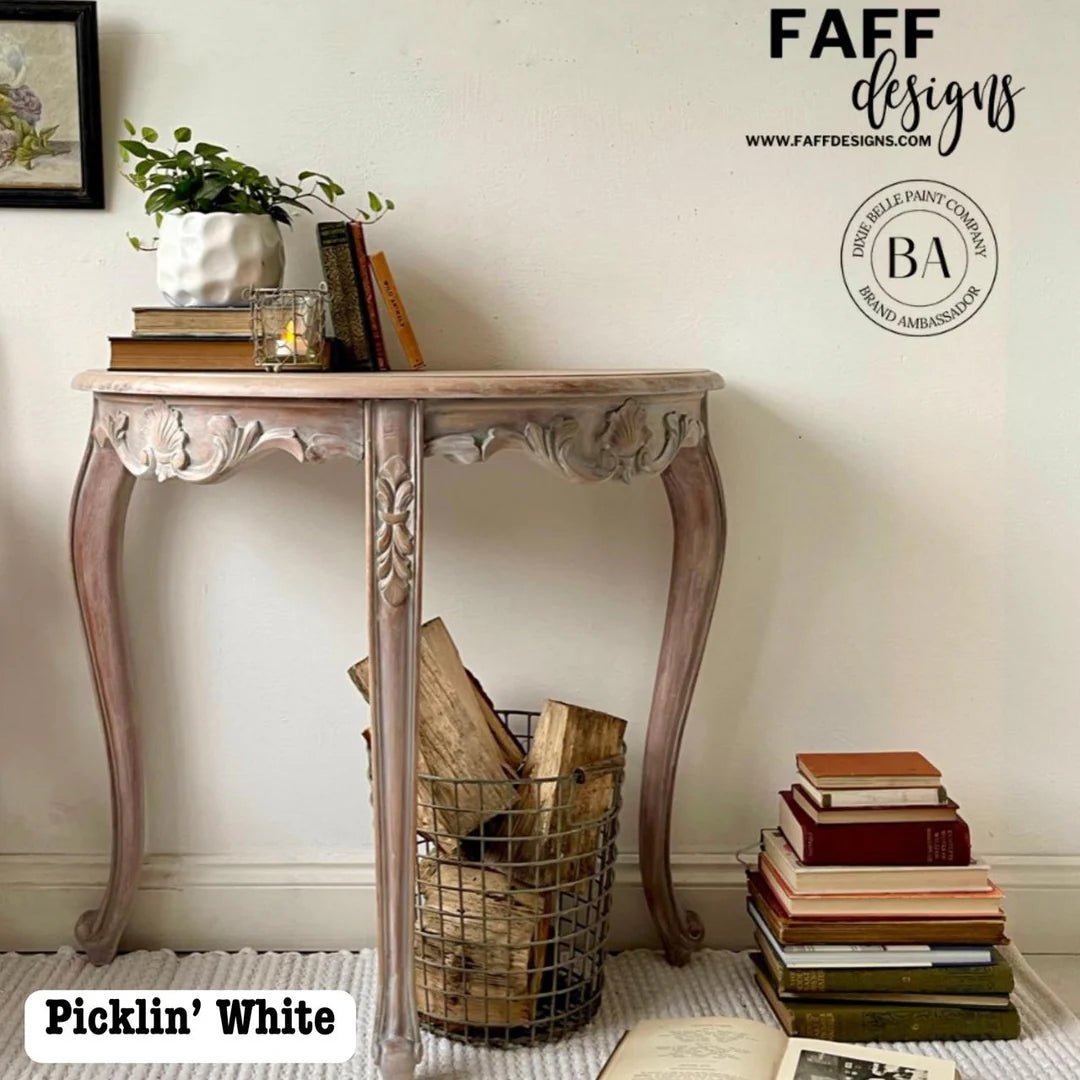 A distressed console table in 'Picklin' White' by Faff Designs, styled in a home interior setting.