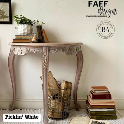 A distressed console table in 'Picklin' White' by Faff Designs, styled in a home interior setting.